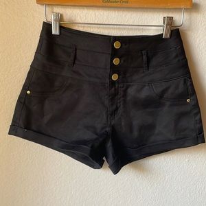 Black shorts with gold buttons